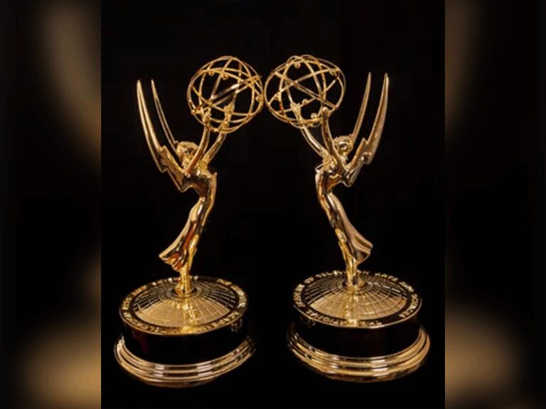 Two Emmy statues side by side with a blurred boarder of the image surrounding them.